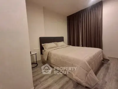 Cozy bedroom with modern decor and soft lighting, perfect for relaxation.