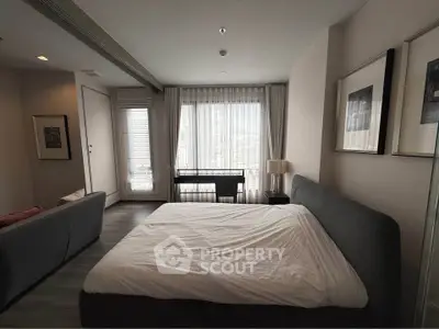 Spacious modern bedroom with large window and stylish decor