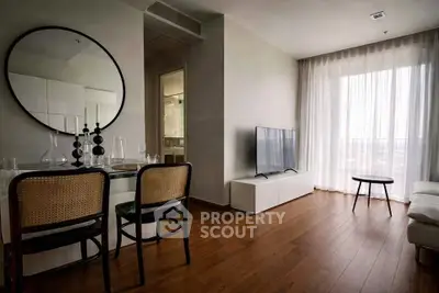 Stylish modern living room with wooden flooring and large window