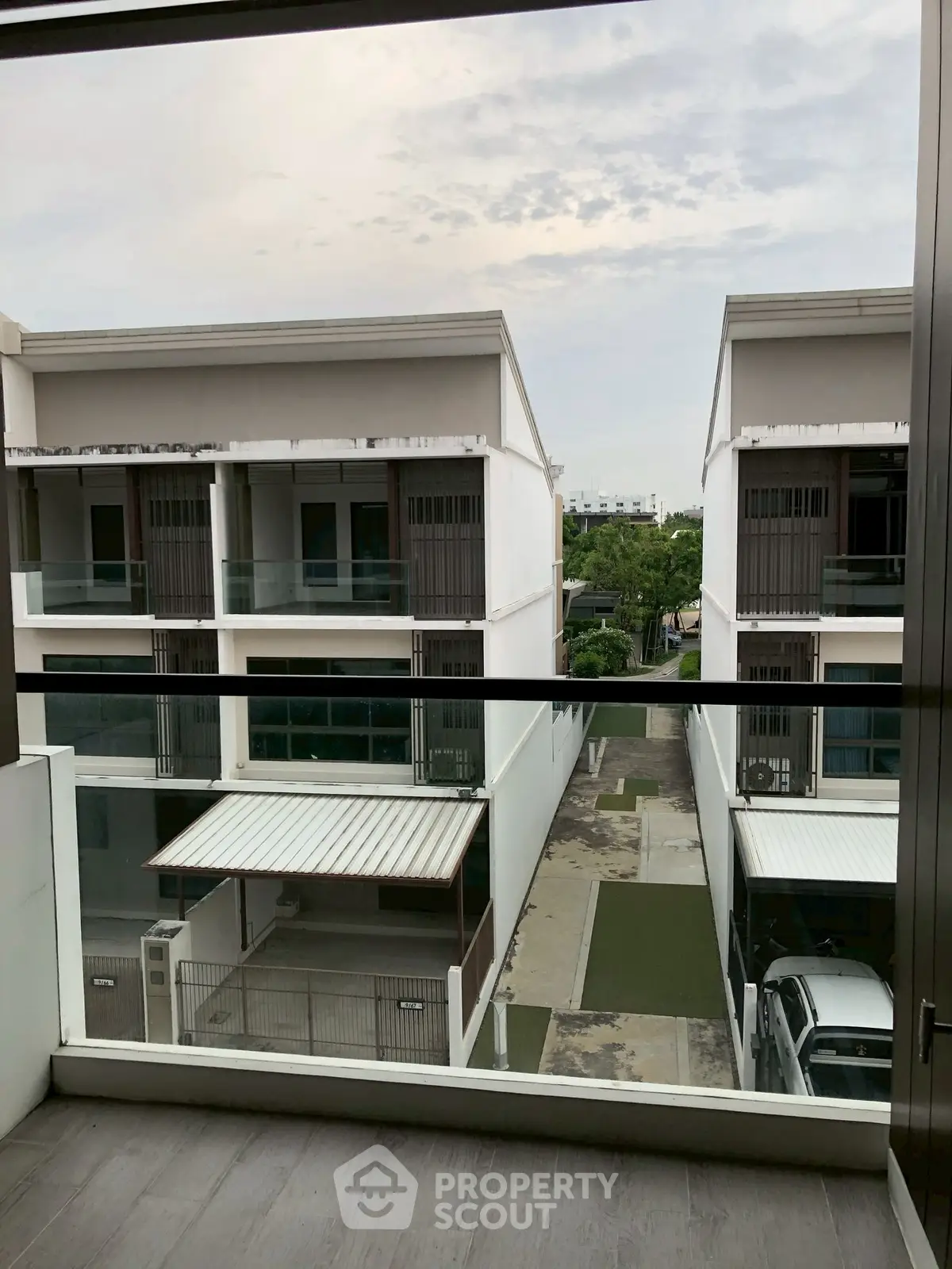 Modern townhouse view from balcony with sleek design and spacious layout.