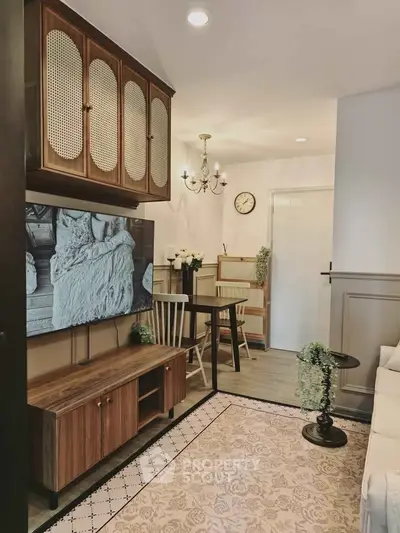 Charming living room with vintage decor and modern TV setup