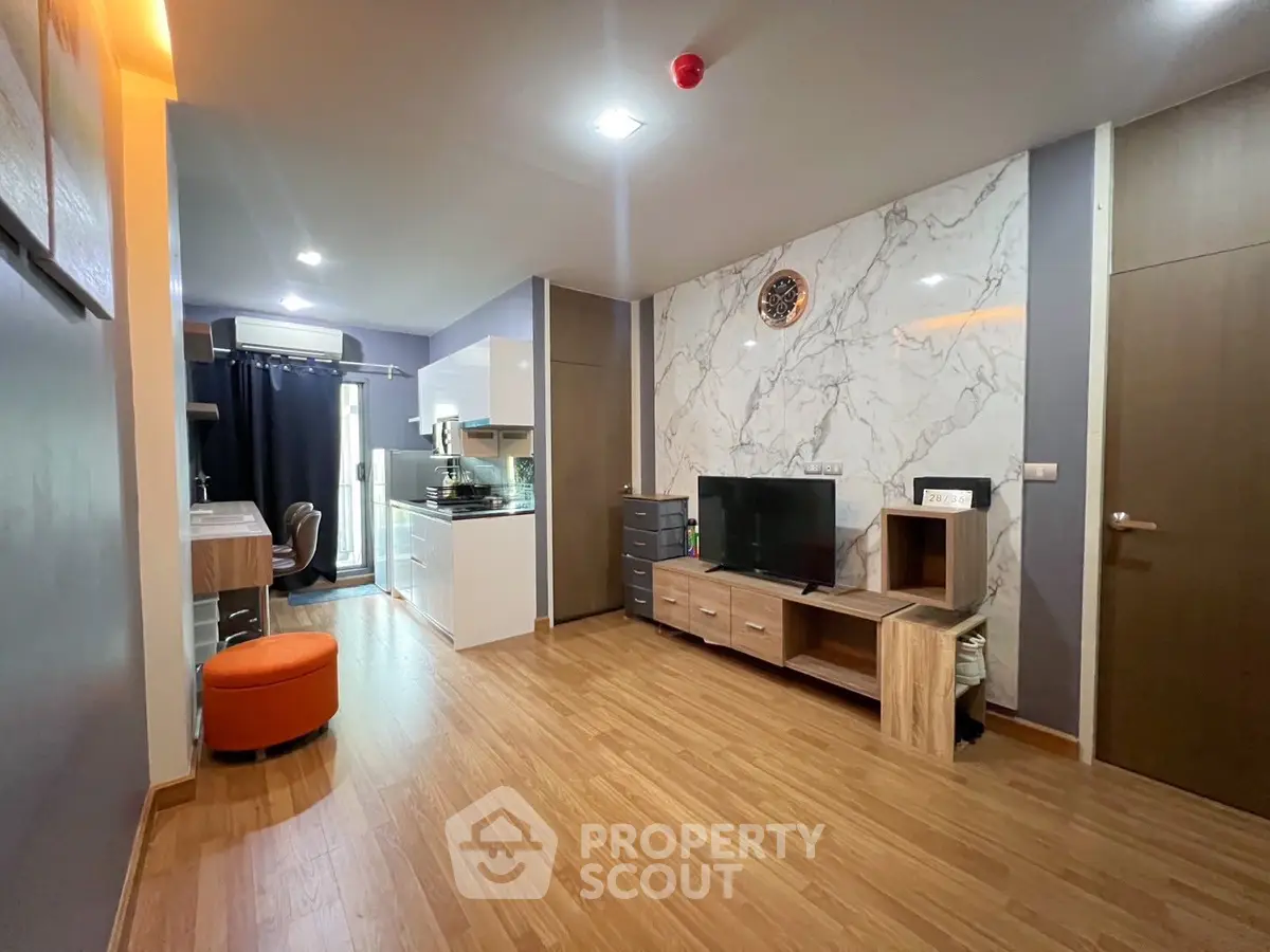 Modern living room with open kitchen and stylish decor