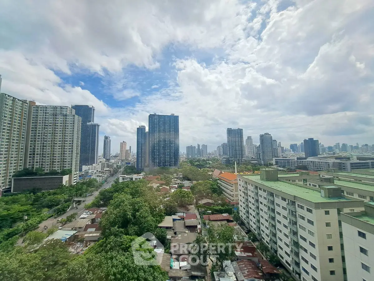 Stunning cityscape view showcasing modern high-rise buildings and lush greenery under a vibrant sky.