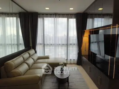 Luxurious living room with modern decor and panoramic city views