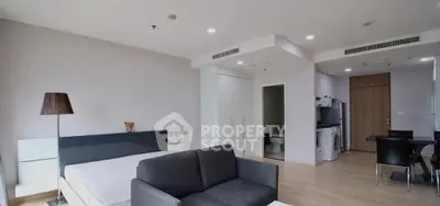 Modern studio apartment with open layout and stylish furnishings