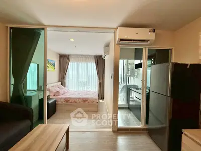 Modern studio apartment with open layout, featuring a cozy bedroom, compact kitchen, and bright living area.