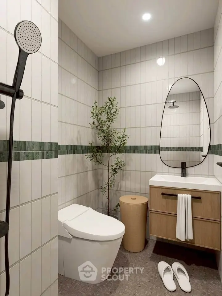 Modern bathroom with sleek fixtures and stylish decor, featuring a shower, toilet, and vanity.