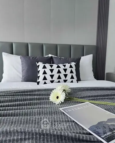 Elegant bedroom with stylish decor and cozy bedding, perfect for relaxation.