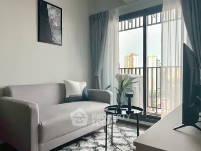 Modern living room with cozy sofa and city view balcony in high-rise apartment.