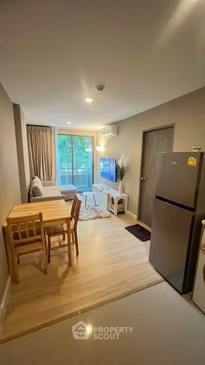 Modern living room with dining area and large window view