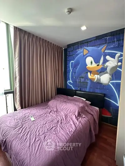 Cozy bedroom with unique Sonic-themed wall art and large window for natural light.
