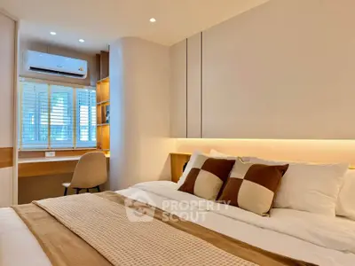 Modern bedroom with cozy bed and stylish workspace