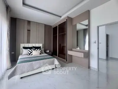 Luxurious modern bedroom with elegant decor and spacious layout, featuring a stylish bed and sleek wardrobe.