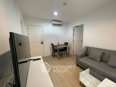 Modern living room with sleek furniture and air conditioning, perfect for cozy gatherings.