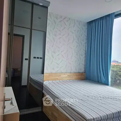 Modern bedroom with large window and stylish decor
