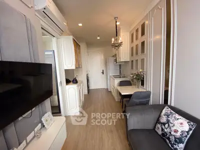 Chic modern living room with elegant decor and compact kitchen area