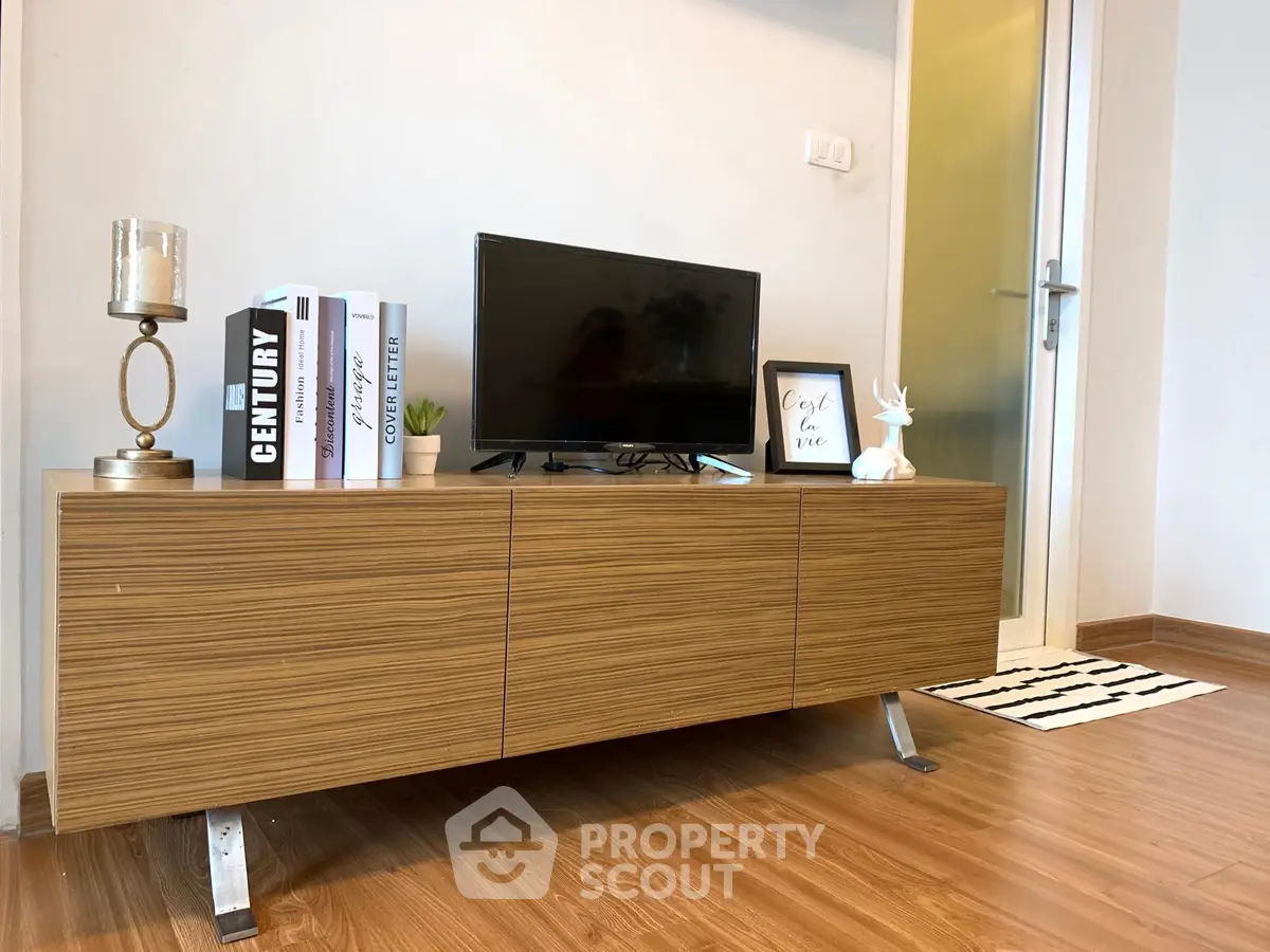 Stylish modern living room with wooden TV stand and decor accents