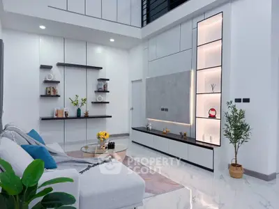 Modern living room with high ceilings, sleek built-in shelves, and stylish decor.