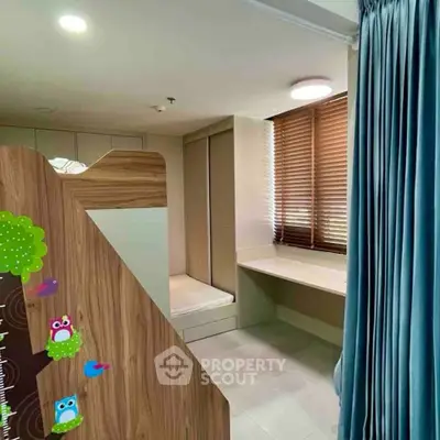 Charming children's bedroom with playful decor and ample natural light.