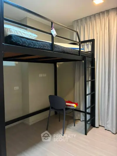 Modern loft bed with study area in a cozy apartment