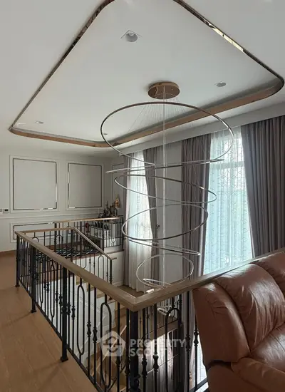 Elegant staircase with modern chandelier and stylish decor in luxurious home interior