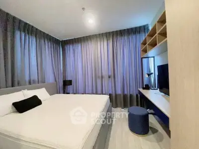 Modern bedroom with stylish decor and ample natural light