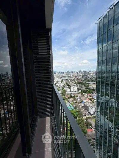Stunning high-rise balcony with panoramic city view, perfect for urban living enthusiasts.