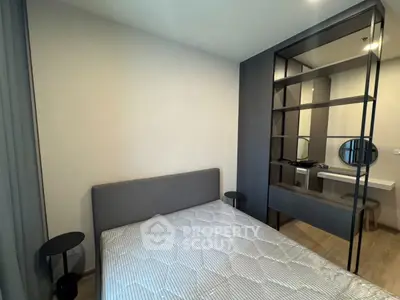 Modern bedroom with stylish decor and comfortable bed in a contemporary apartment.