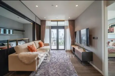 Luxurious living room with modern decor and city view, featuring plush seating and large TV.