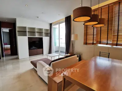 Modern living room with stylish furniture and large windows for natural light.