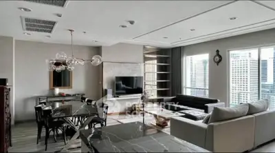 Luxurious modern living room with city view, elegant furniture, and stylish lighting.