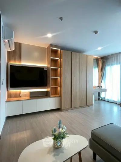 Modern living room with built-in TV unit and stylish wooden cabinetry