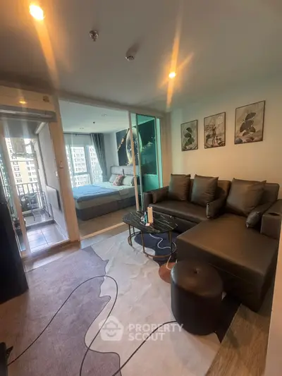 Modern living room with stylish decor and balcony view in urban apartment