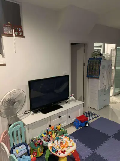 Cozy living room with TV, toys, and modern decor