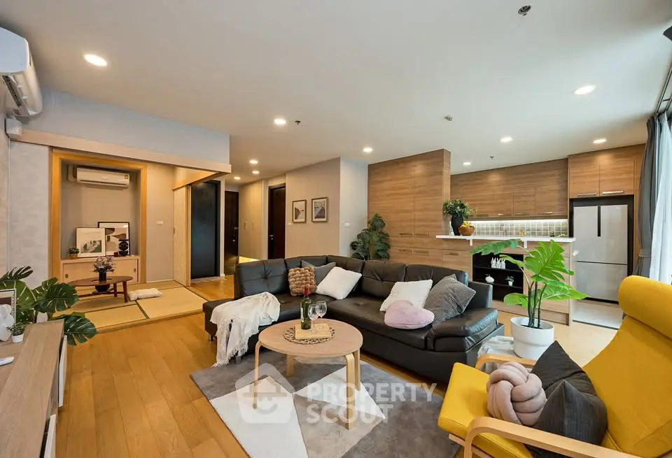 Spacious modern living room with open kitchen and stylish decor