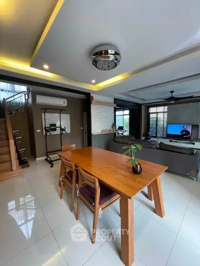Modern living room with elegant dining area and stylish decor