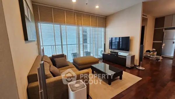 Spacious modern living room with large windows and stylish furniture
