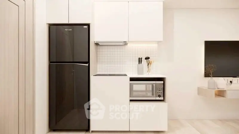Modern minimalist kitchen with sleek appliances and white cabinetry