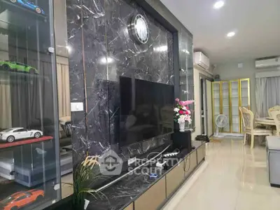 Luxurious living room with marble accent wall and modern decor