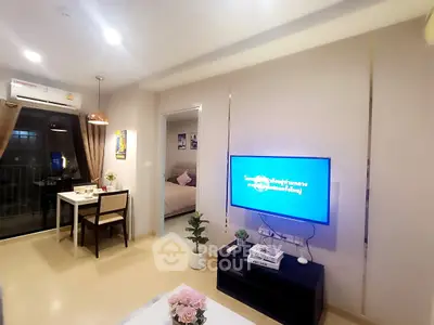 Modern living room with dining area and balcony access in a stylish apartment.