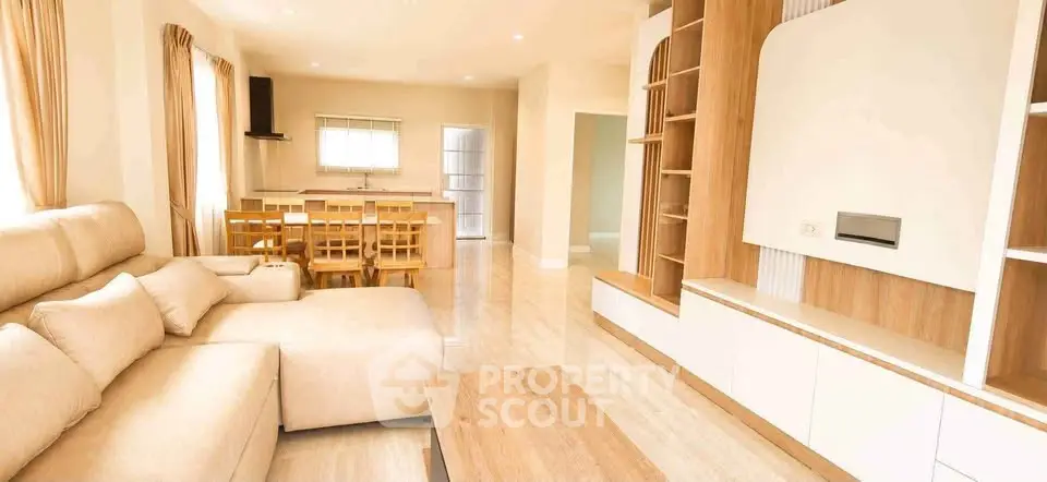 Spacious living room with modern furniture and open layout, perfect for family gatherings.