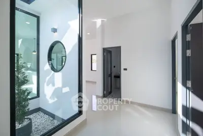 Modern minimalist interior with large windows and sleek design