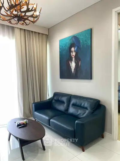 Stylish living room with modern leather sofa and unique artwork