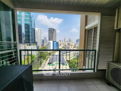 Stunning cityscape view from a modern balcony in a high-rise building.