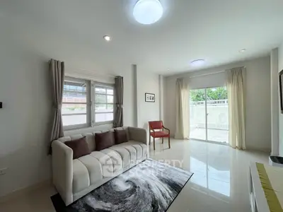 Bright and modern living room with large windows and stylish decor