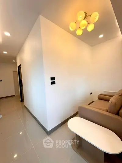 Modern living room with sleek design and cozy seating area