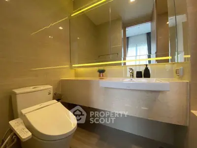 Modern bathroom with sleek fixtures and ambient lighting