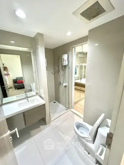 Modern bathroom with sleek fixtures and spacious shower area
