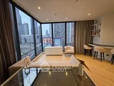 Luxurious corner unit living room with panoramic city views and elegant furnishings.
