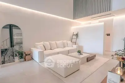 Modern living room with elegant white sofa and minimalist decor
